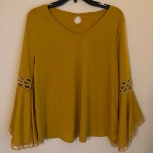 Yellow shirt with flared sleeves
